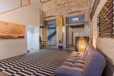 a living room with a couch in the middle of the room at Loveporto Varanda Jardim Centro in Porto