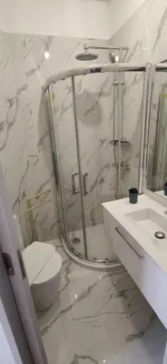 a bathroom with a shower and a toilet and a sink at Ribeira Riverview Panoramic in Porto