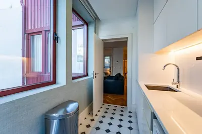 a pair of chairs sitting on a deck at Intimate Apartment Downtown With Terrace - D in Porto