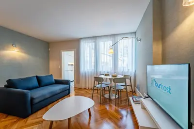 a living room with a couch and a table at Intimate Apartment Downtown With Terrace - D in Porto