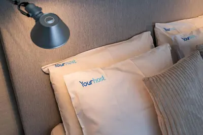 a bedroom with a bed with two towels on it at Oporto Chic and Glamorous Downtown with Terrace-F in Porto