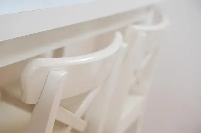 a white chair sitting next to a window at GuestReady - A lovely city retreat in Porto