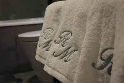 a towel with the word ash on it on a bathroom at Ribeira Memories 72 in Porto