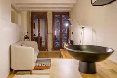 a living room with a bowl sink in a room at Tailor's Apartments II in Porto
