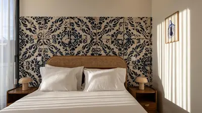 a bedroom with a bed with a black and white wallpaper at New 3BR w Rooftop & Balcony Views by LovelyStay in Porto