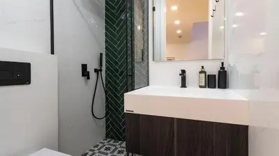 a bathroom with a sink and a shower at New 3BR w Rooftop & Balcony Views by LovelyStay in Porto