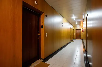 a corridor of a hallway with wooden walls and a corridorngthngthngthngthngth at Casa Agustina, Central and sunny Studio with optional Parking in Porto