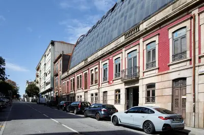 a white car parked on a street next to buildings at Casa Agustina, Central and sunny Studio with optional Parking in Porto