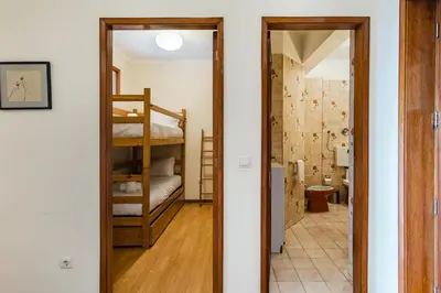 a door leading to a room with a bunk bed at GuestReady - Bonfim Cozy Retreat in Porto