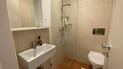 a bathroom with a shower and a sink and a toilet at BEST - Studio Trindade with AC and Parking in Porto