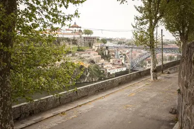 a view of a city with a bridge over a river at Casa do Sol in Porto