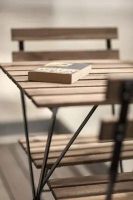a book sitting on top of a wooden table at Casa do Sol in Porto