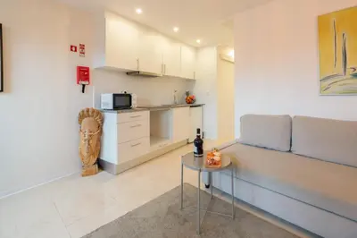 a living room with a couch and a table at HostWise - Artistic Escape with Modern Comfort in Vila Nova de Gaia