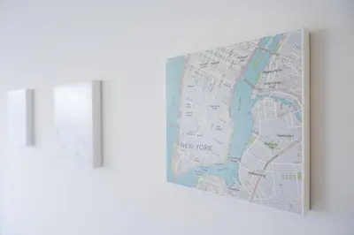 a map hanging on a wall next to a window at GuestReady - Mandariam Studio in Porto