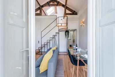 a living room with a couch and a table at GuestReady - Visconde Mezzanine in Porto