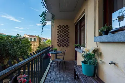 a balcony of a house with a table and chairs at Botanic Jungle at Porto Downtown in Porto
