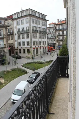 a white car parked on a bridge in a city at Porto with History in Porto