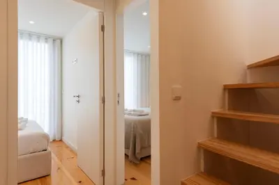 a room with a room with a bed and a closet at Porto Luxe Stay with shared Pool and Garden in Porto