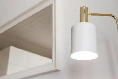 a light on a door with a mirror at GuestReady - The Citrus Glaze at the Terrace in Porto