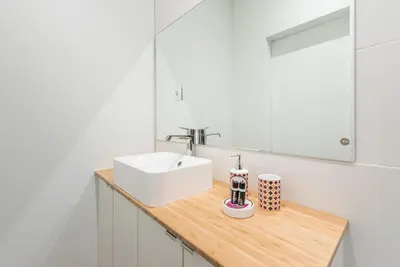 a bathroom with a white sink and a counter at GuestReady - Fabric in Colors in Porto