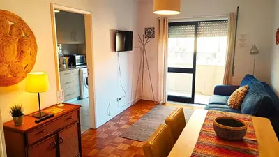 a living room with a couch and a table at Porto Downtown in Porto