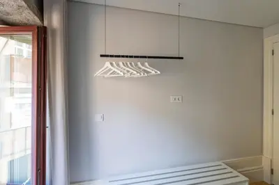 a kitchen with a light hanging from the ceiling at ApartmentsPorto - Rua de Trás 156 in Porto