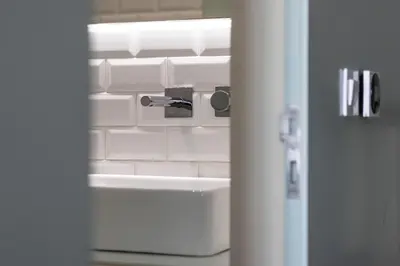 a door view of a kitchen with a sink at ApartmentsPorto - Rua de Trás 156 in Porto