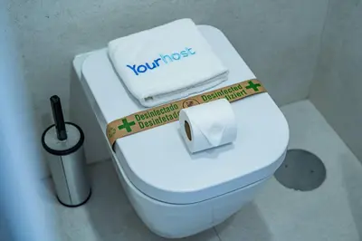 a toilet with a box on the top of it at Bellevue Oporto Downtown in Porto