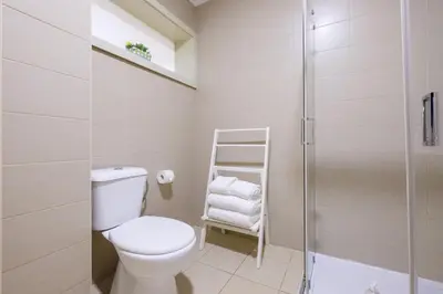a bathroom with a toilet and a shower at GuestReady - Hope Apartments in Porto