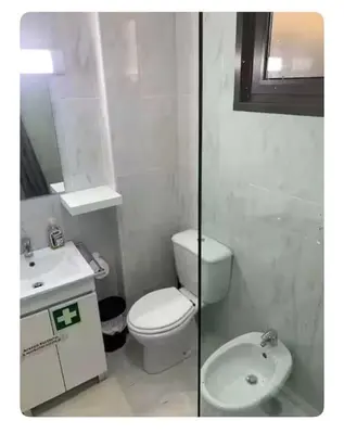 a white bathroom with a toilet and a sink at Best Stay in Porto in Porto