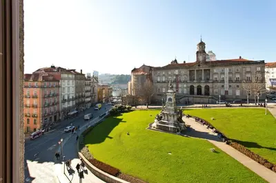 a view of a city with a statue in a park at BOUTiQUE Rentals- THE MiRaDOURO Ribeira Apartment in Porto