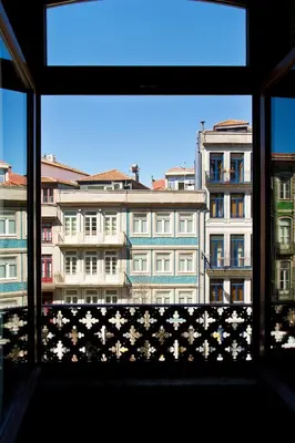 a window with a view of a building at Boutique Rentals-SãO bEnTo Ribeira Apt in Porto