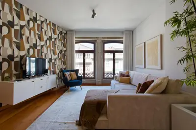 a living room with a couch and a tv at Boutique Rentals-SãO bEnTo Ribeira Apt in Porto