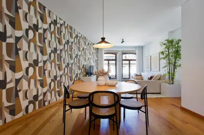 a dining room with a table and chairs at Boutique Rentals-SãO bEnTo Ribeira Apt in Porto
