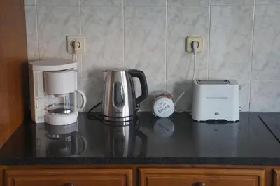 a kitchen counter with two coffee machines on it at Casa no centro histórico in Vila Nova de Gaia