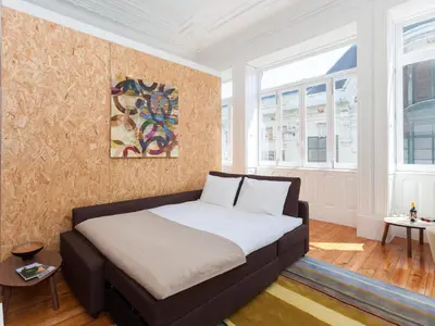 a bedroom with a bed in a room at BO - Sá da Bandeira in Porto