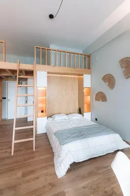 a bedroom with a bunk bed and a ladder at Batalha Charming Loft in Porto