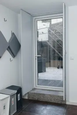 a sliding glass door with a view of a courtyard at Ark of Aqua Flat in Porto