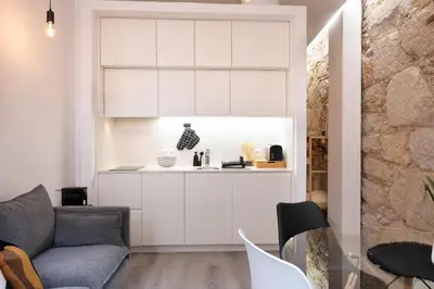 a living room with a couch and a table at St Ildefonso 02 in Porto