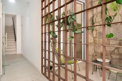 a room with a wall with plants on it at St Ildefonso 03 in Porto
