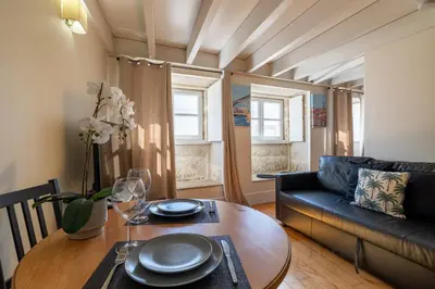 a living room with a white couch and a table at Vaz Porto Apartment - Porto Velho Apt in Porto