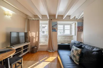 a living room with a white couch and a table at Vaz Porto Apartment - Porto Velho Apt in Porto