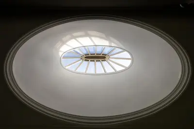 a ceiling light in a room with a window at Casa Flores - in Historical Center in Porto