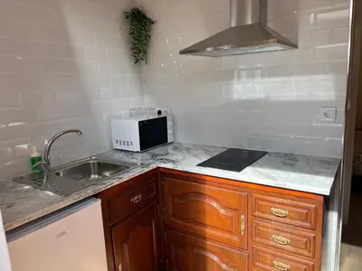 a kitchen with a sink and a microwave at River Pace III in Porto