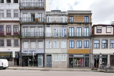 a tall building on a city street at VIVA Boho Chic in Porto