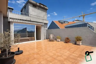 a patio with chairs and plants on a building at HOTIDAY Room Collection - Oporto in Porto