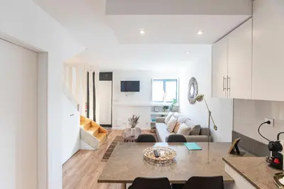 a living room with a couch and a table at FLH Porto Central TownHouse in Porto
