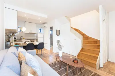 a living room with a couch and a table at FLH Porto Central TownHouse in Porto