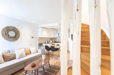 a living room with a couch and a table at FLH Porto Central TownHouse in Porto