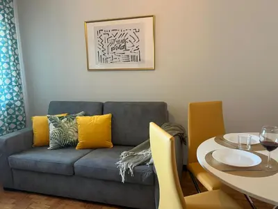 a living room with a couch and a table at Happy Mountain in Porto
